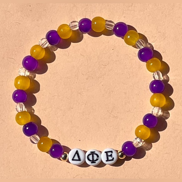 Delta Phi Epsilon Glass Bead Bracelet with Greek Letters 7” Purple Gold Clear - Picture 1 of 4